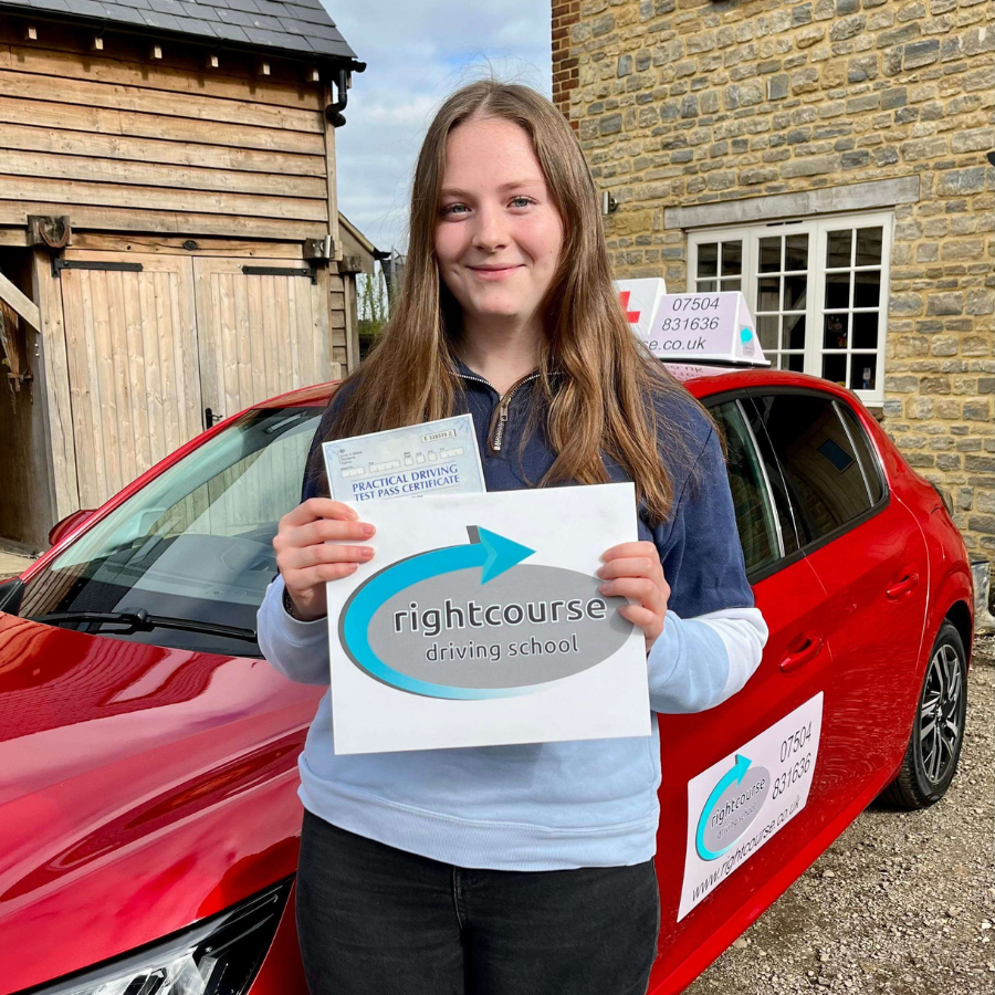 Right Course learner holding her driving test pass certificate