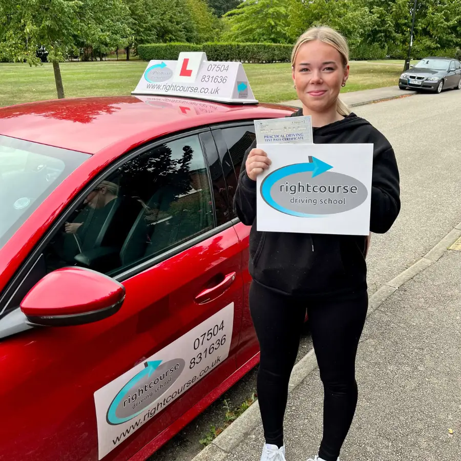 Right Course Driving School learner holding their driving test pass certificate.