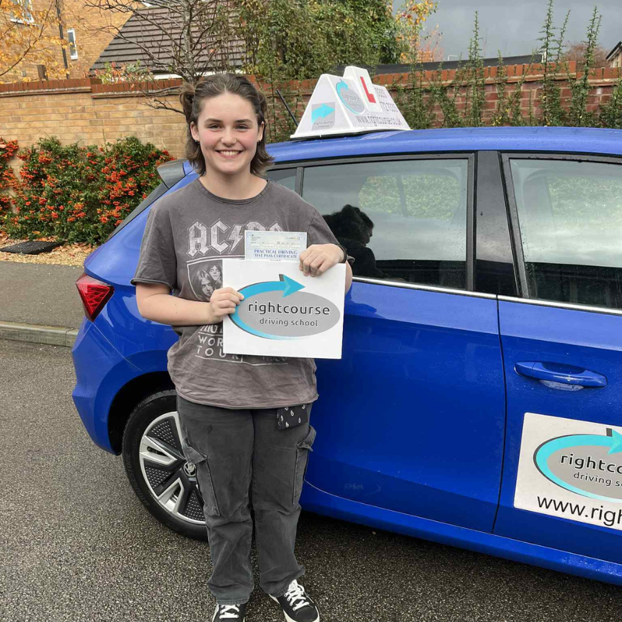 Imogen holding her pass certificate