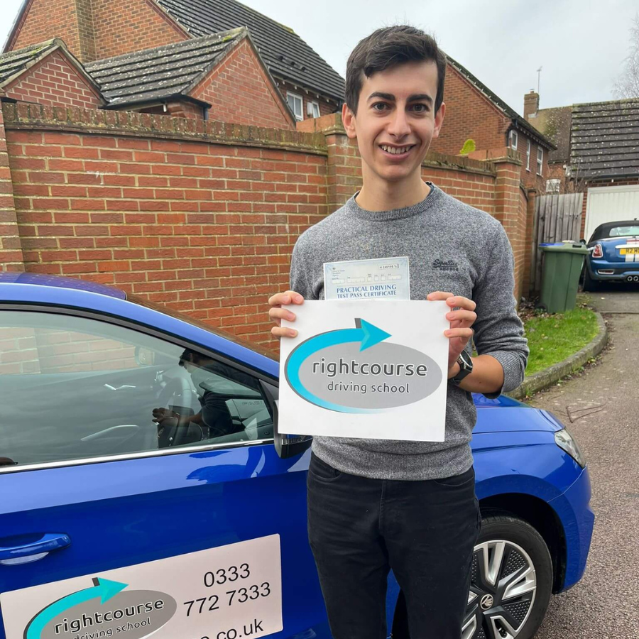 Eddie Proudly Holding His Pass Certificate