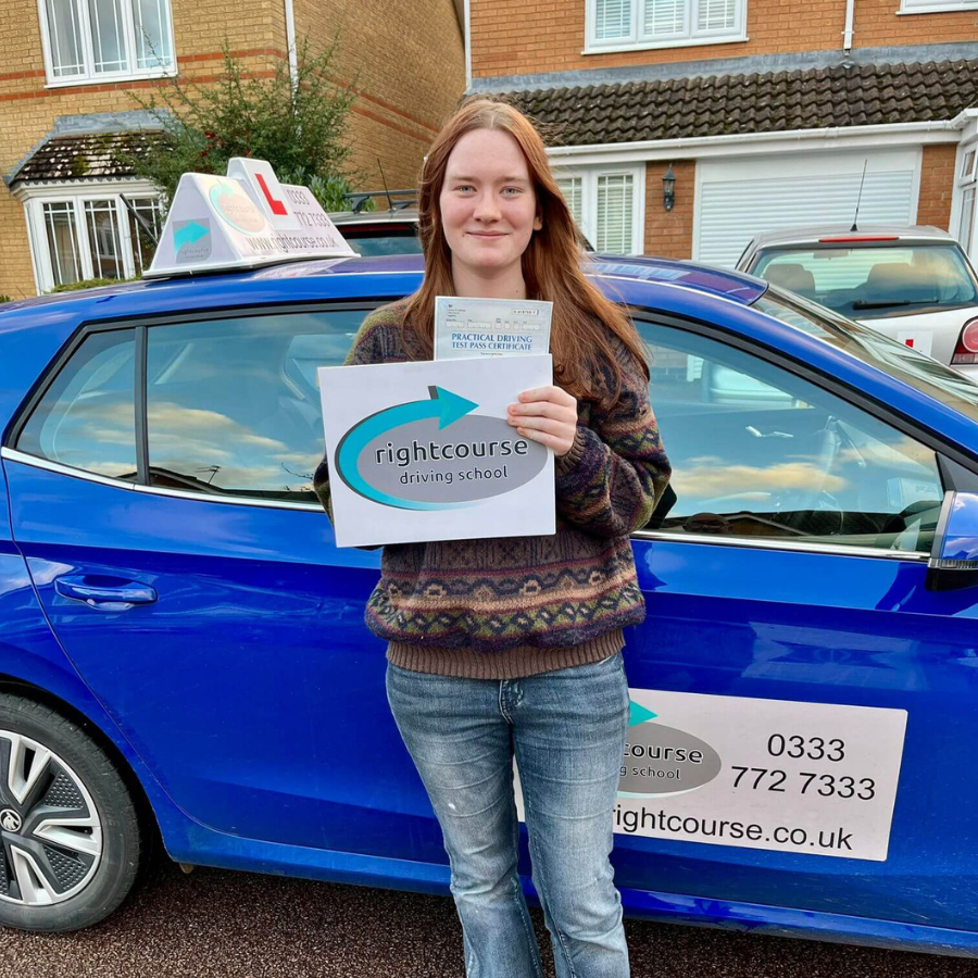 Izzy Proudly Holding Her Pass Certificate