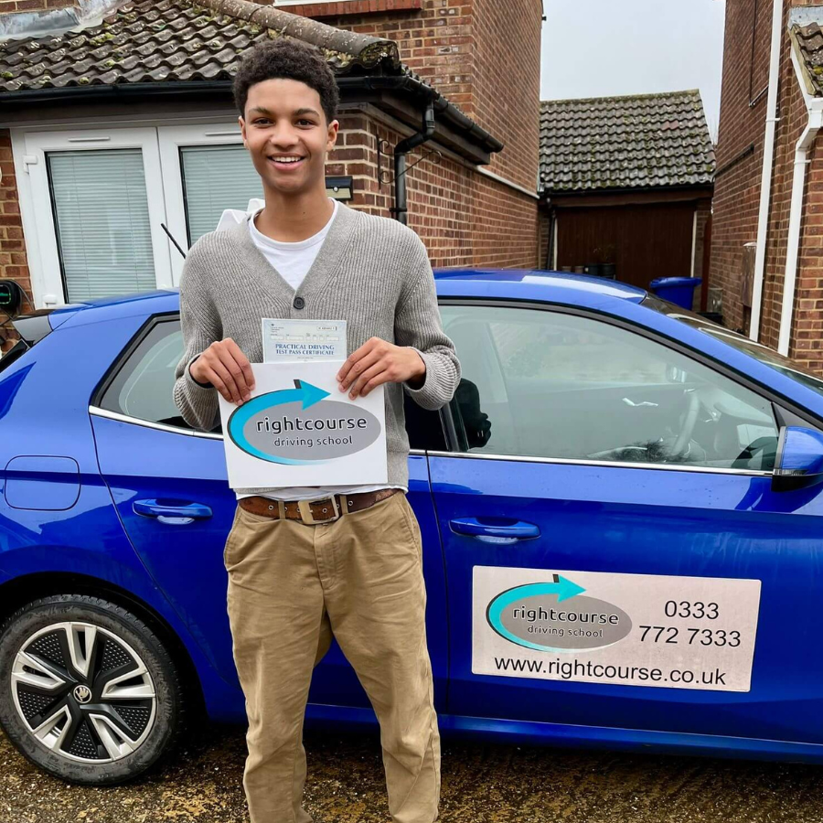 John Proudly Holding His Pass Certificate